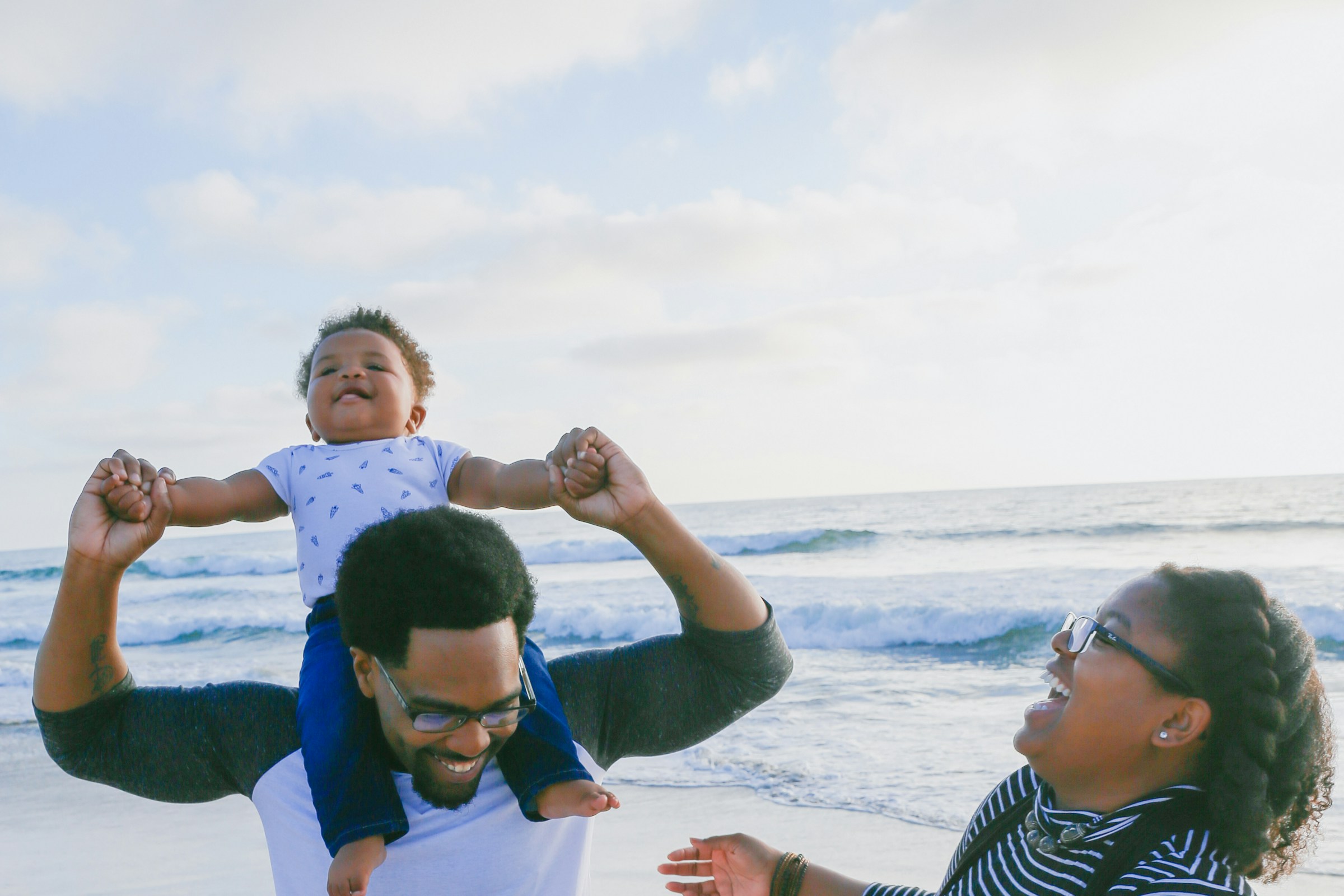 A family enjoying time together beside the sea