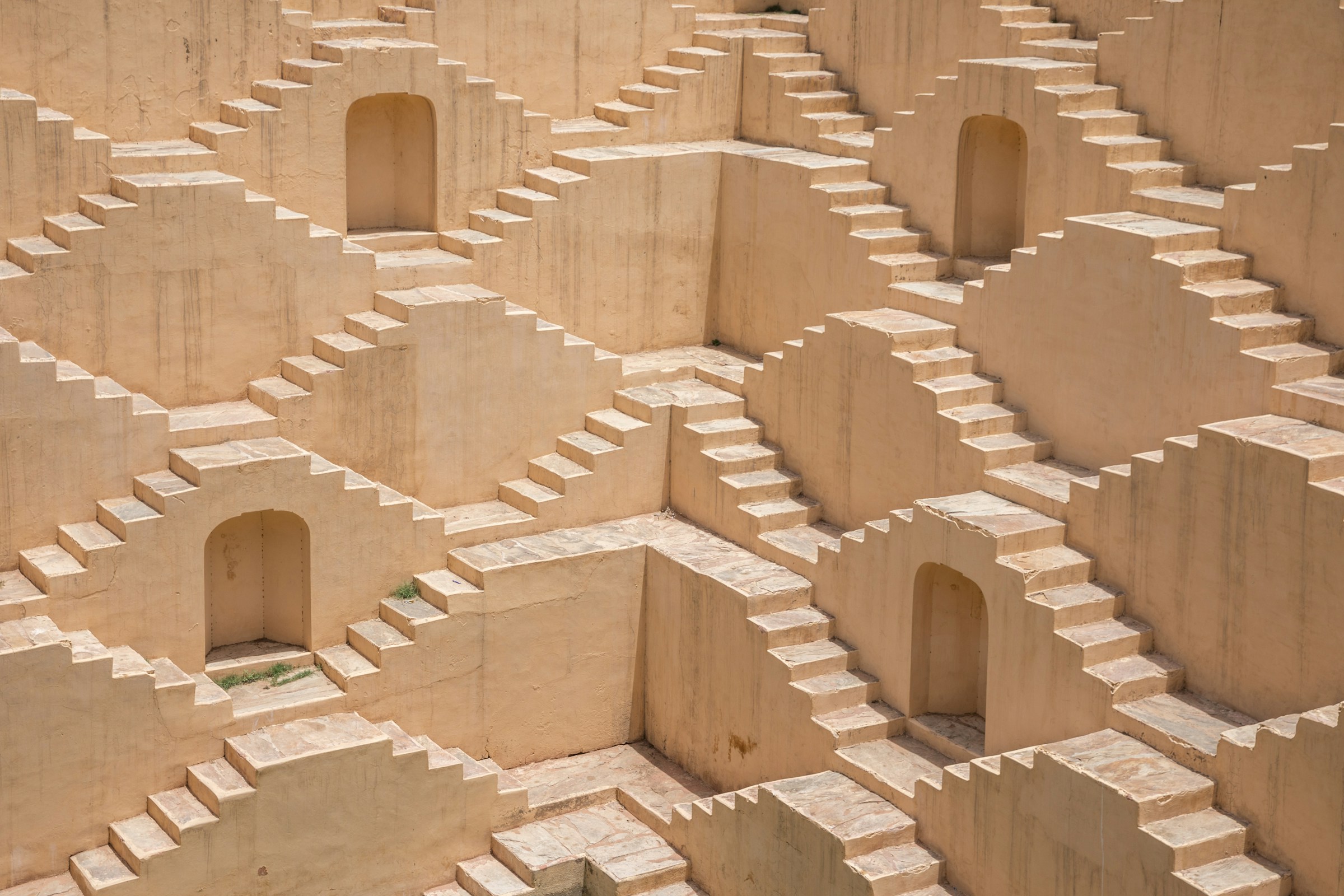 Geometric sandstone stairways in a historic stepwell