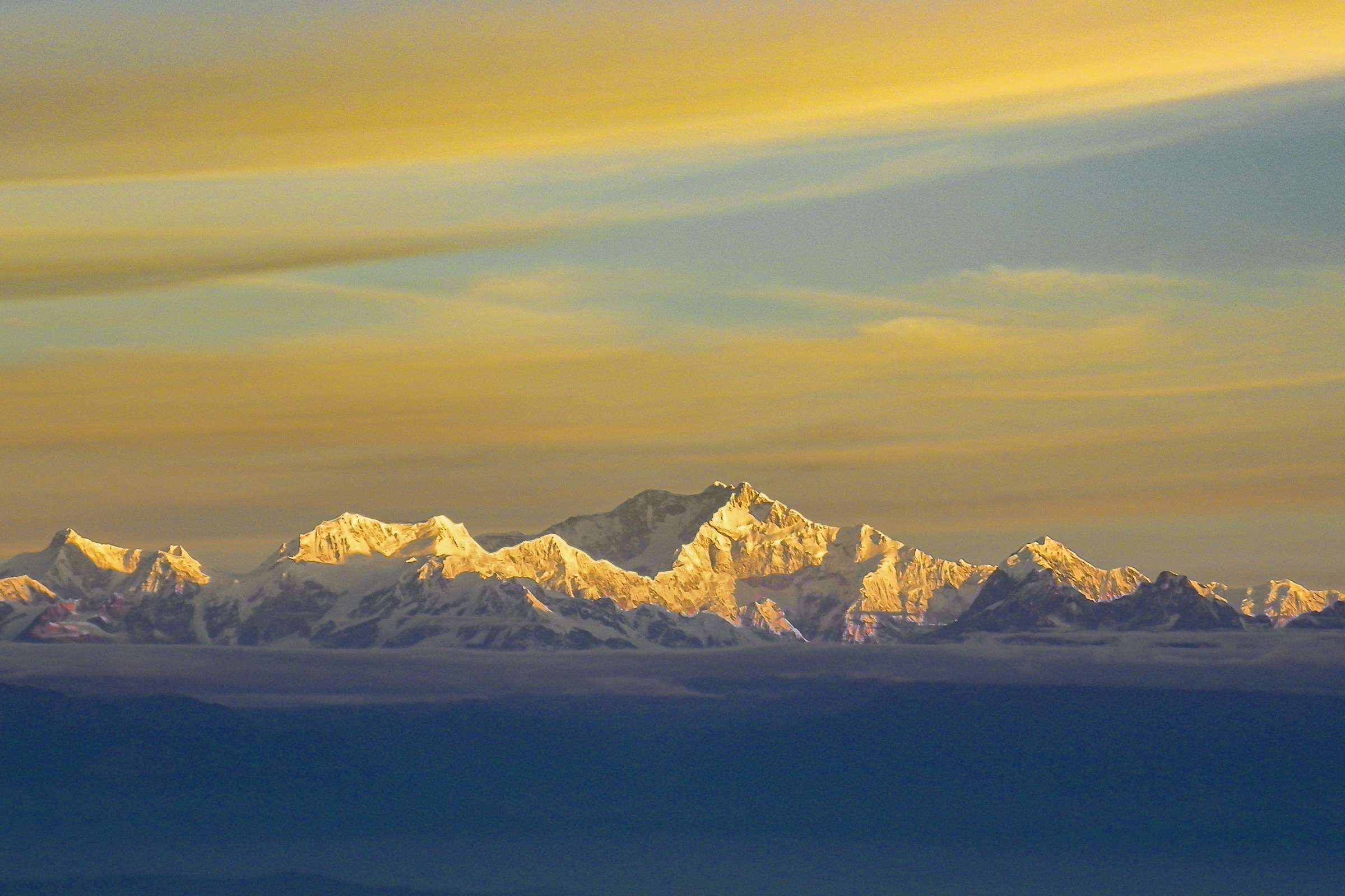 Snow-covered Himalayan peaks seen from Darjeeling at sunrise