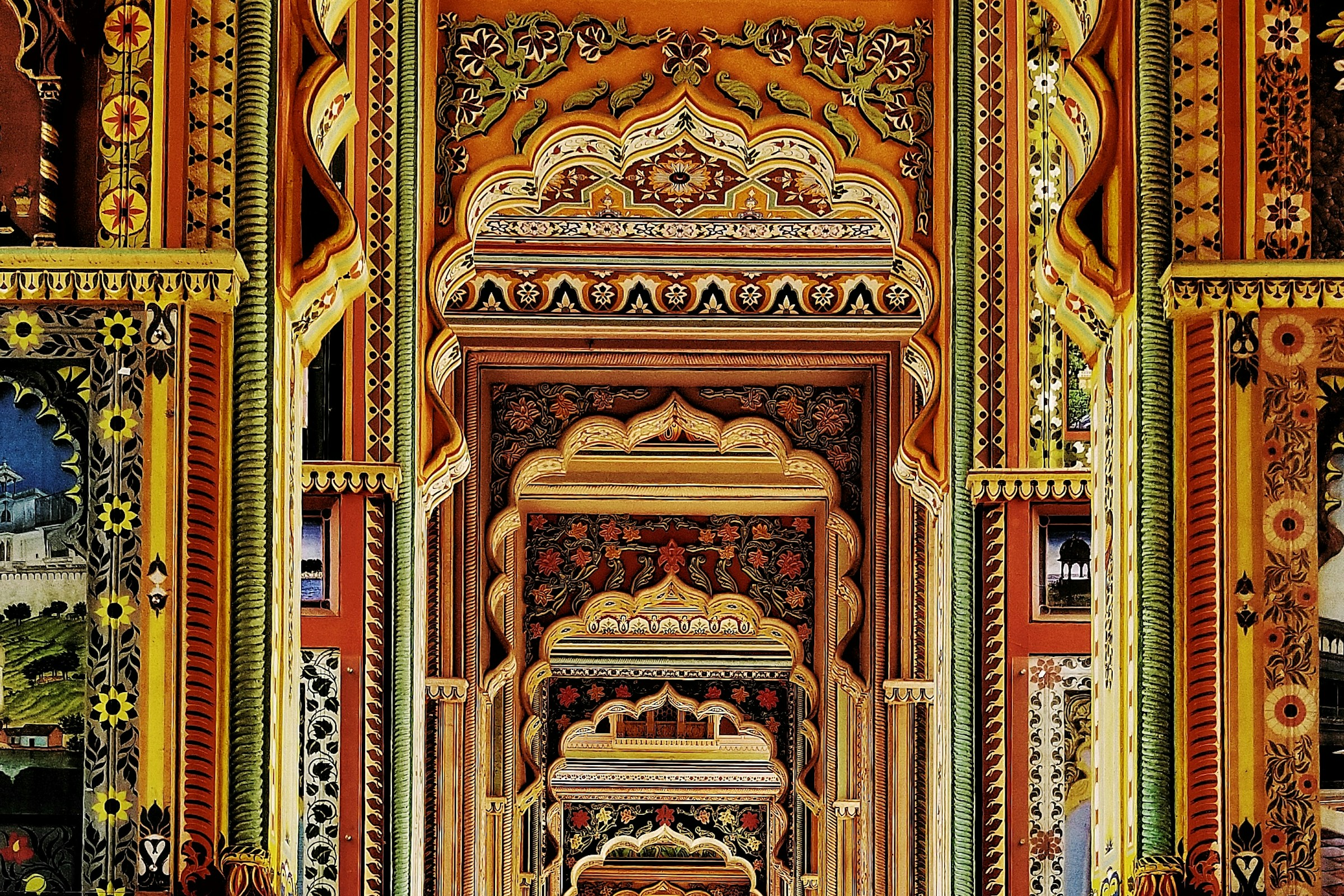 A sequence of colourful arches in a Jaipur palace