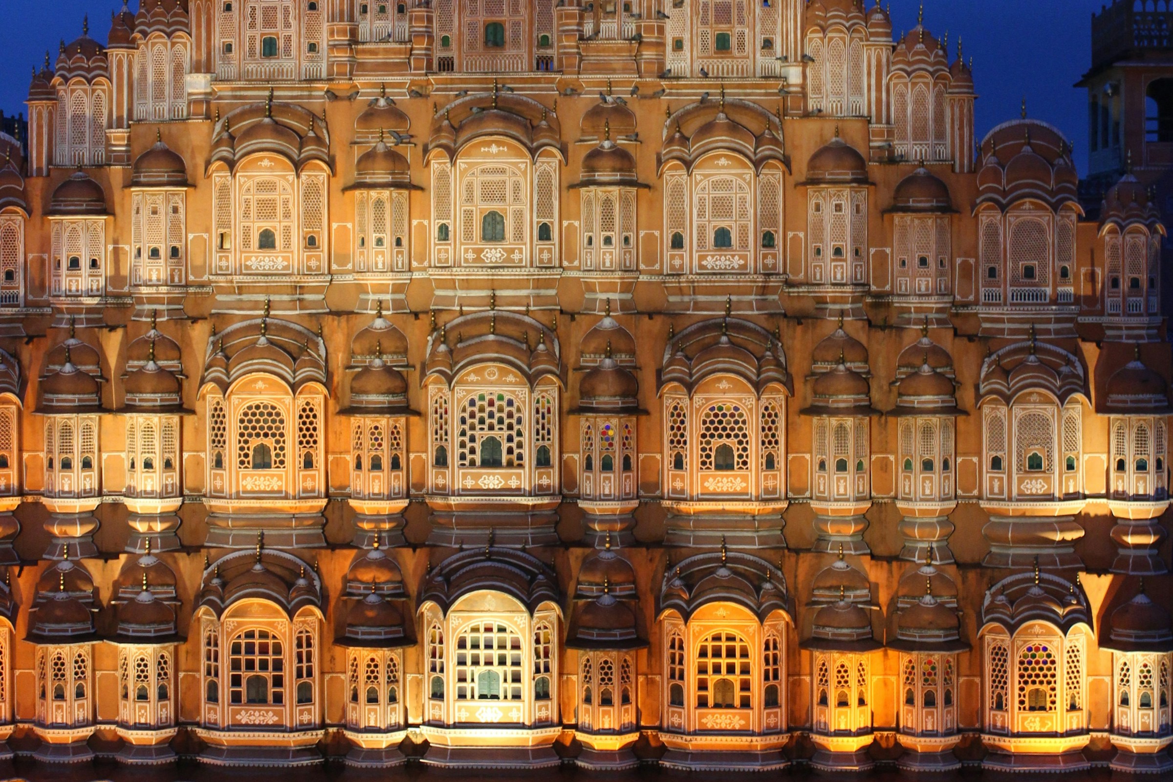 Hawa Mahal illuminated against Jaipur's blue evening sky