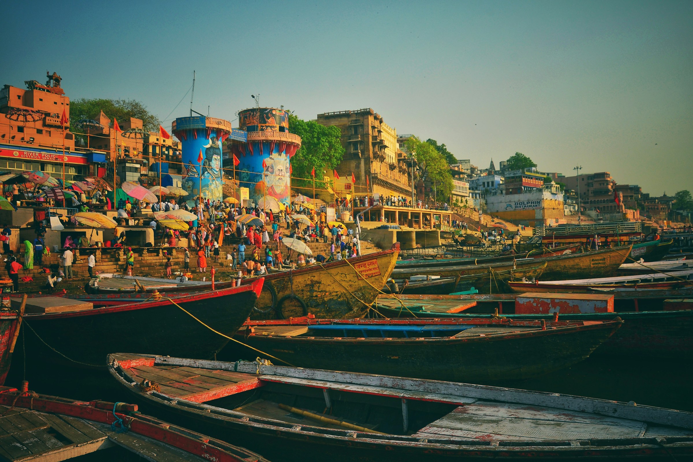 Boats and colourful buildings along the ghats of Varanasi